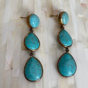 Turquoise stone drop earrings.